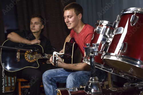 young people playing guitars