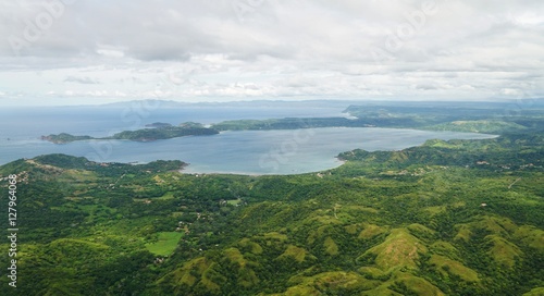 Aerial view in the clouds of rhe Golfo del Papagayo with the Peninsula Papagayo near Liberia, Costa Rica photo