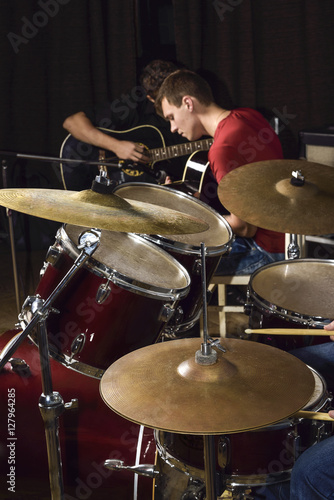 young people playing guitars