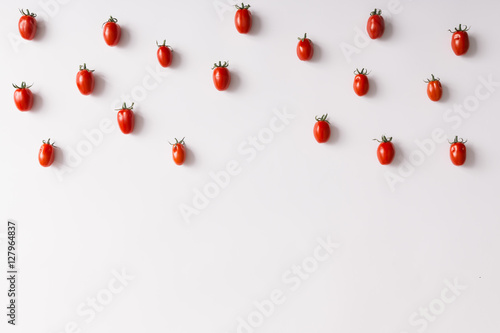 Cherry tomatoes pattern on white background