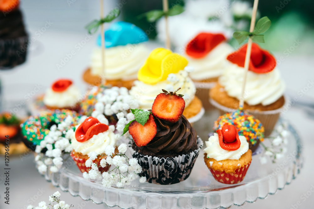 Candy bar cupcakes decorated in cowboy style. Close-up. Candy bar cupcakes decorated in cowboy style. Close-up.