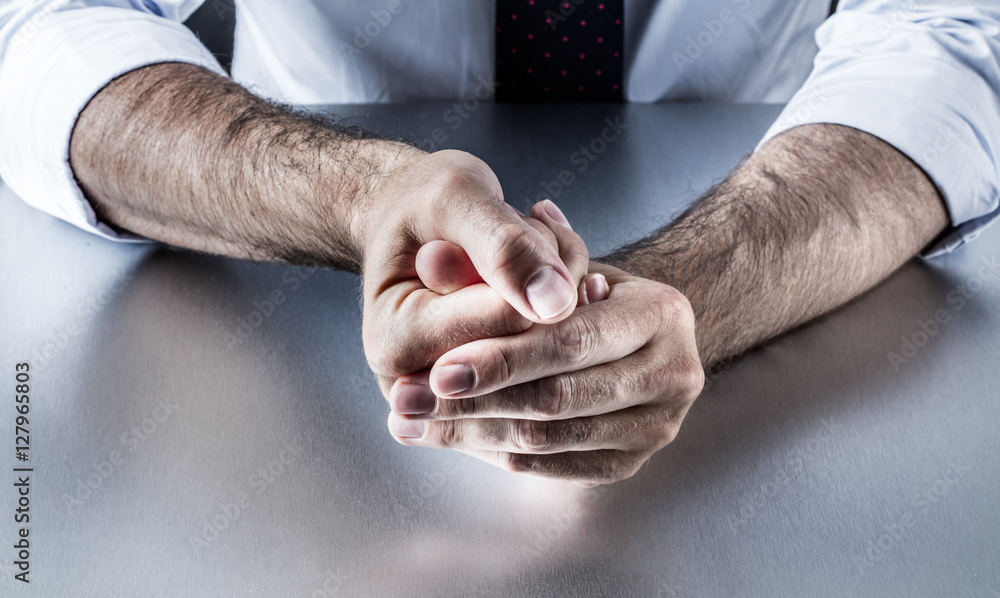 Fototapeta premium bothered businessman hands holding fingers with tension expressing controlled exasperation