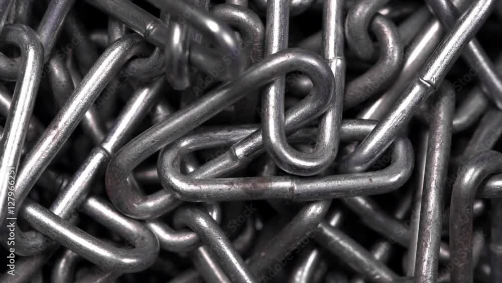 Metal chain rotating background. Closeup Metal chain rotating background. Closeup