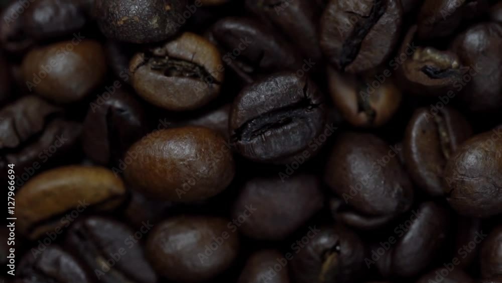 Rotating and falling Coffee beans. Slow Motion
Rotating and falling Coffee beans. Slow Motion