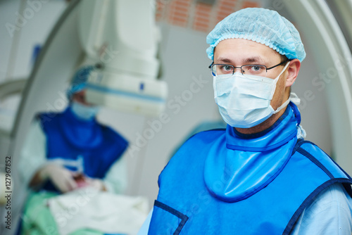 male andiography surgeon at surgery operating room photo