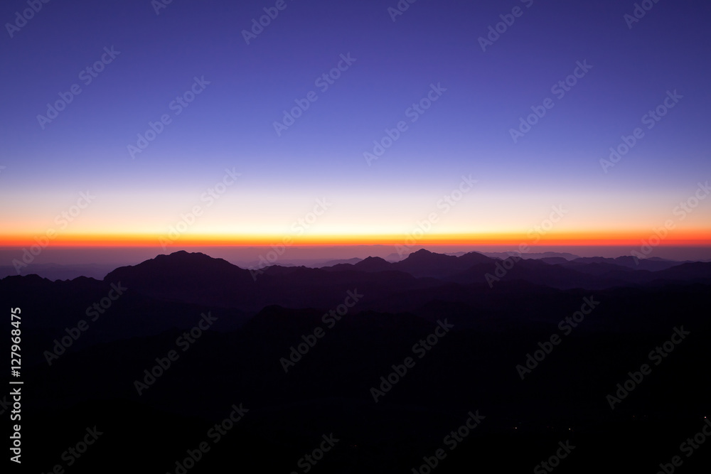 Fototapeta premium sunrise or sunset at mountains by night