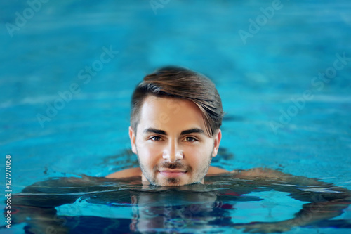 Young man in swimming pool