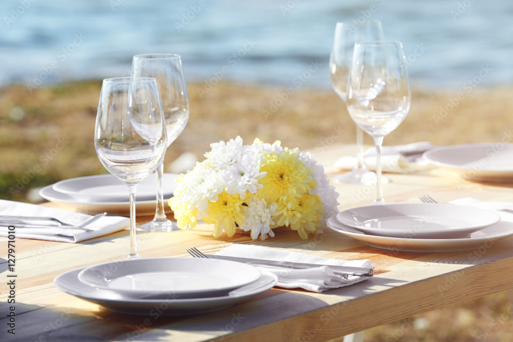 Table setting for buffet catering party outdoors, close up view