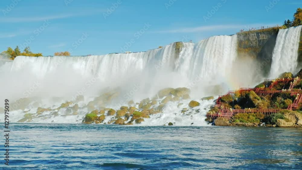 Slow motion video: A stunning Niagara Falls. Bottom view. falling water weight raises a lot of spray and mist Slow motion video: A stunning Niagara Falls. Bottom view. falling water weight raises a lot of spray and mist