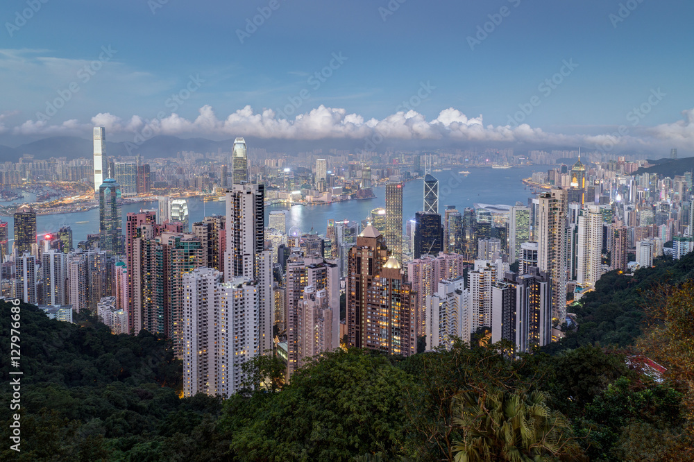 Scenic view of Hong Kong's famous skyline as seen from the Victoria Peak in the early evening. Copy space.