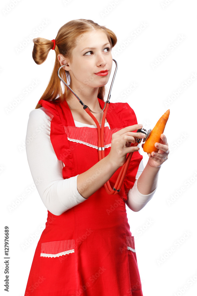 Young beautiful housewife in bright red apron with funny ponytai Young beautiful housewife in bright red apron with funny ponytai