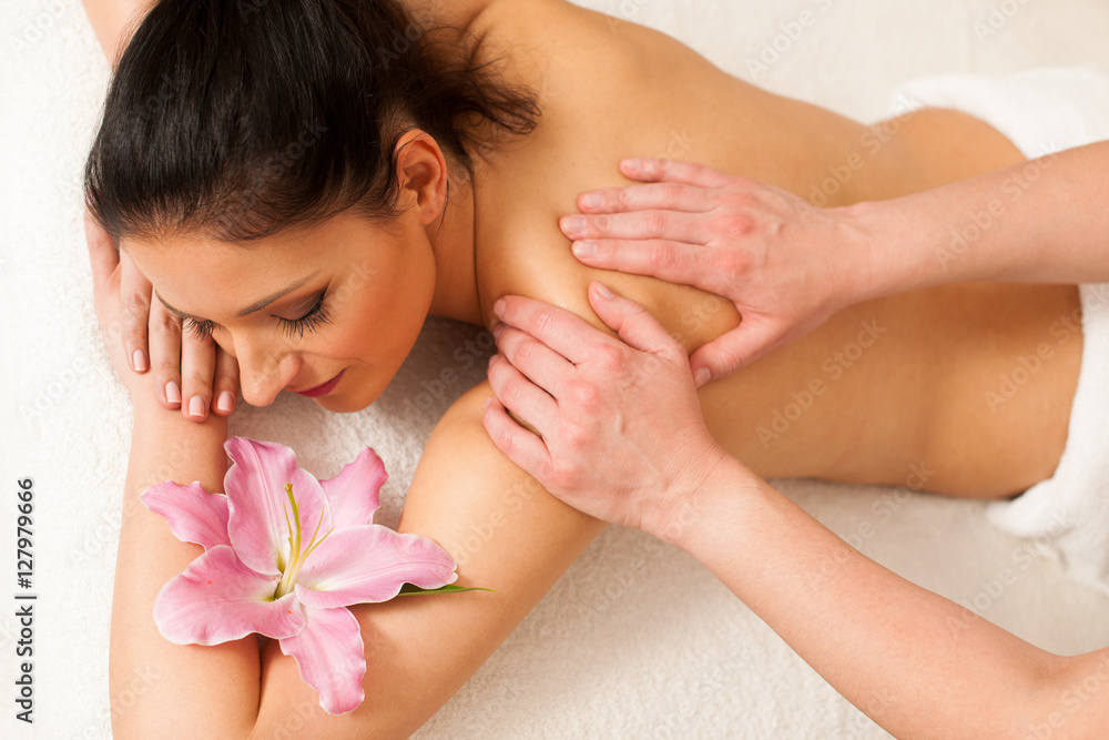 Beautifulyoung woman having a rejuvenating massage in a wellness Beautifulyoung woman having a rejuvenating massage in a wellness