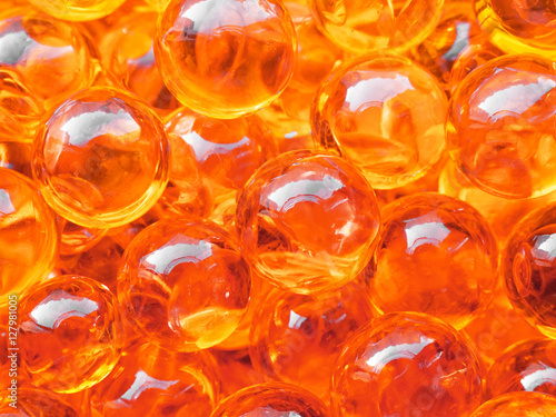 Red caviar bubbles close-up background. Protein healthy sea food