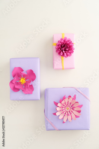 Nicely wrapped presents decorated with handmade paper flowers