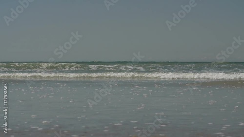 Water washing ashore in slow motion.