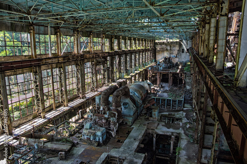 Abandoned  destroyed by war and overgrown machinery of Tkvarcheli power plant 