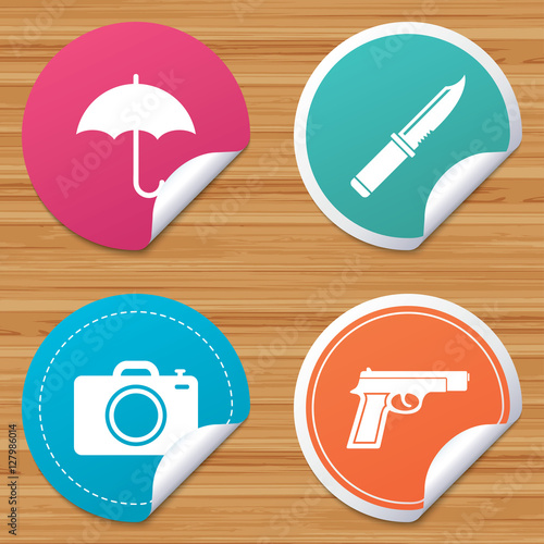 Round stickers or website banners. Gun weapon icon.Knife, umbrella and photo camera signs. Edged hunting equipment. Prohibition objects. Circle badges with bended corner. Vector