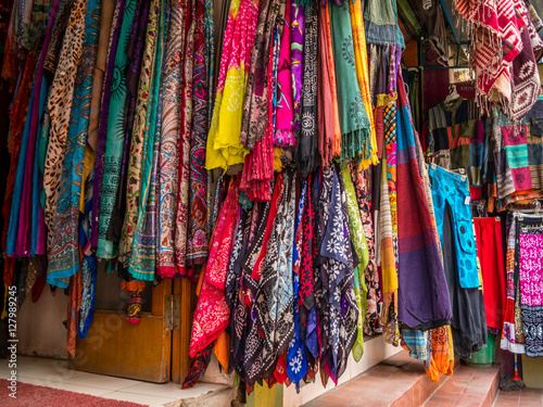 Nepali Store Front Displaying Many Scarves © danadestinations