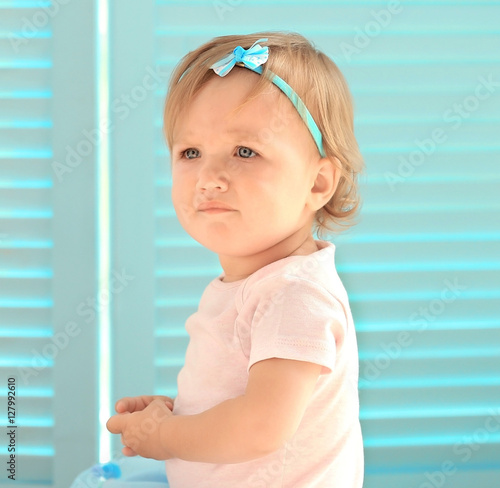 Baby girl in a beautiful dr...