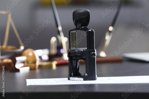Black stamp and document on...