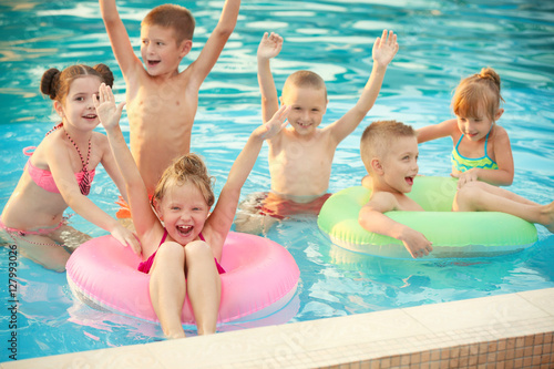 Little kids in swimming poo...