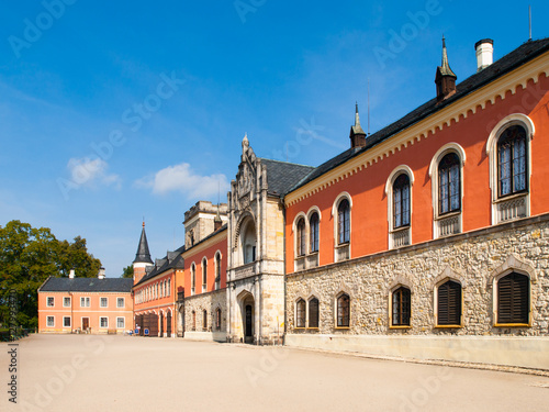 Sychrov Castle with typical pink facade. Neo-Gothic style chateau with beautiful english style park. Bohemian Paradise, Czech Republic