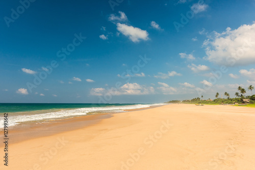 Tropical beach with boat in Sri lanka.