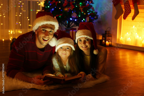 Happy family reading book i...