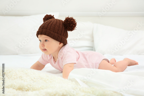 Cute baby wearing funny cap...