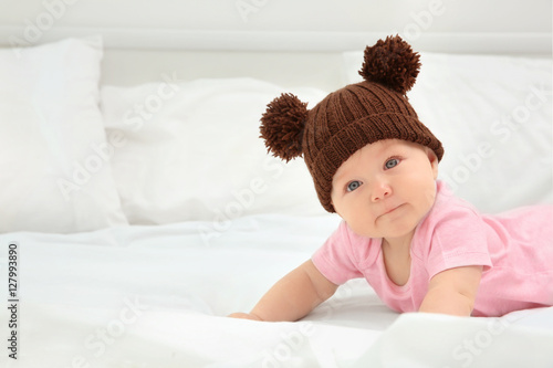 Cute baby wearing funny cap...