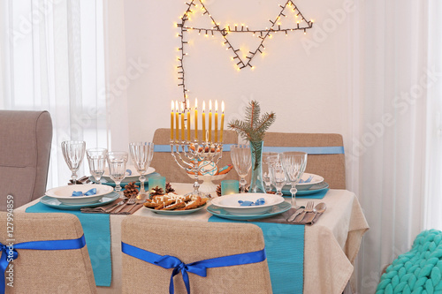 Interior of beautiful living room decorated for Hanukkah photo