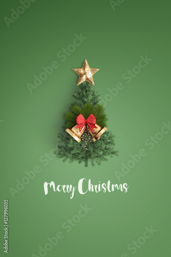 merry christmas and chirstmas tree on color background