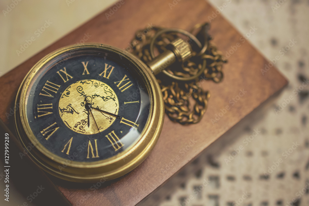old pocket watch with chain on box wood vintage tone old pocket watch with chain on box wood vintage tone