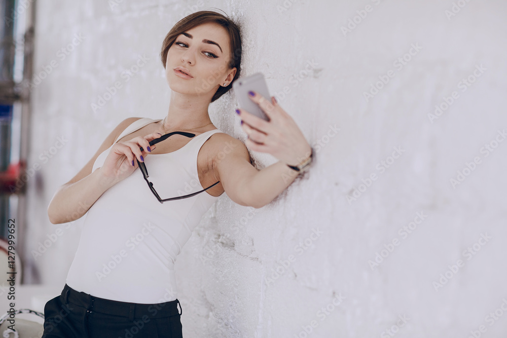 the girl uses her phone the girl uses her phone