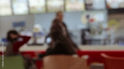 Food court and customers blurred background with bokeh effect time lapse shot.