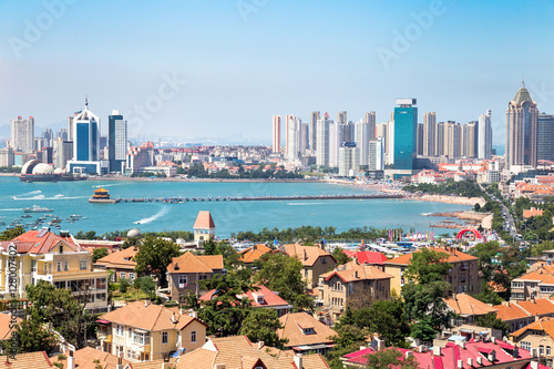 Qingdao Bay with Zhanqiao Pier seen from the hill of XiaoYuShan Park, Qingdao. Zhanqiao is the famous pavilion displayed on the bottles of Qingdao beer photo