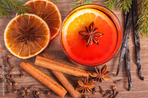 Mulled wine for christmas or winter evening with spices and spruce branches