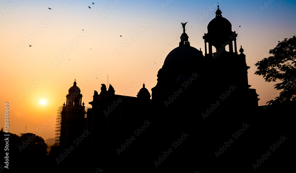 Silhouette sunrise at Victoria Memorial architectural building Kolkata, India.