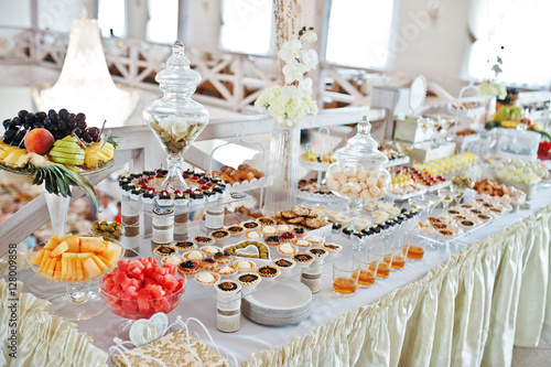 Wedding reception with different sweets and fruits.