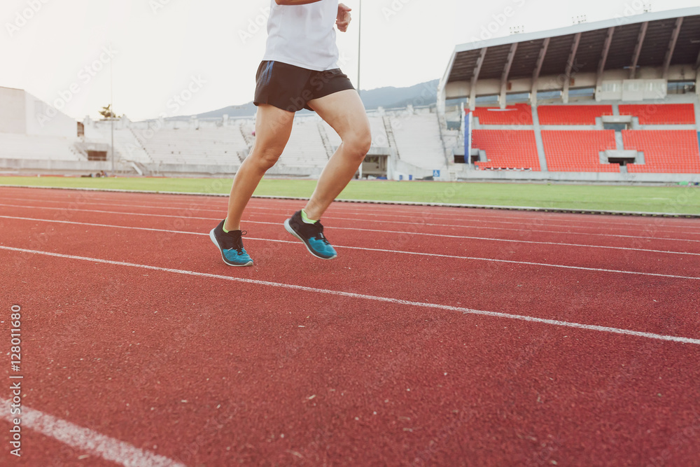 Fototapeta premium Runners sprinting outdoors Sportive people training in a urban a