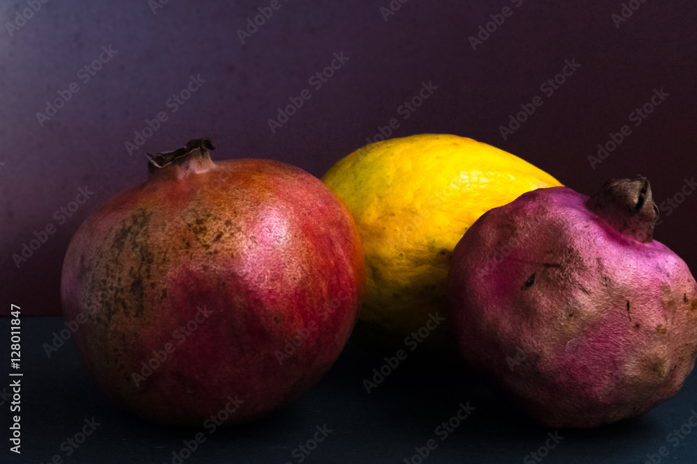 Arranged delicious exotic fruits still life on dark background Arranged delicious exotic fruits still life on dark background