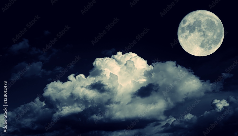 Night sky and a full moon in the clouds