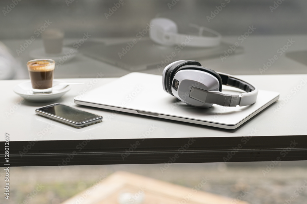 Espresso, smartphone, laptop and headphones Espresso, smartphone, laptop and headphones