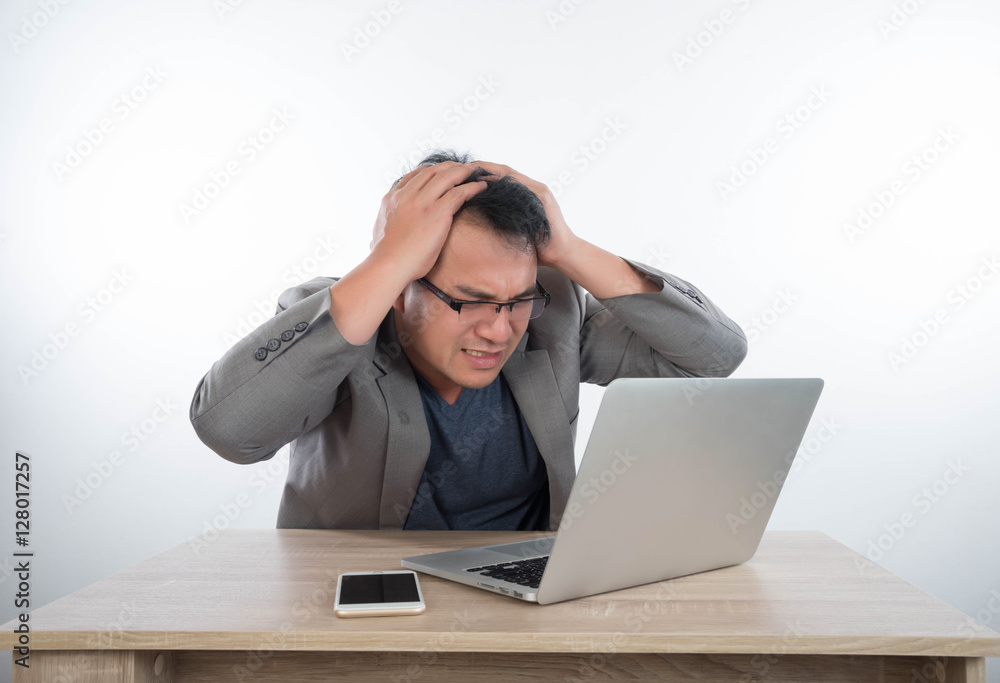 young businessman Stressful jobs using a laptop sitting thinking young businessman Stressful jobs using a laptop sitting thinking