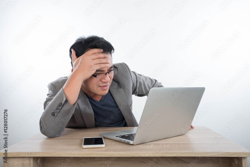 young businessman Stressful jobs using a laptop sitting thinking young businessman Stressful jobs using a laptop sitting thinking