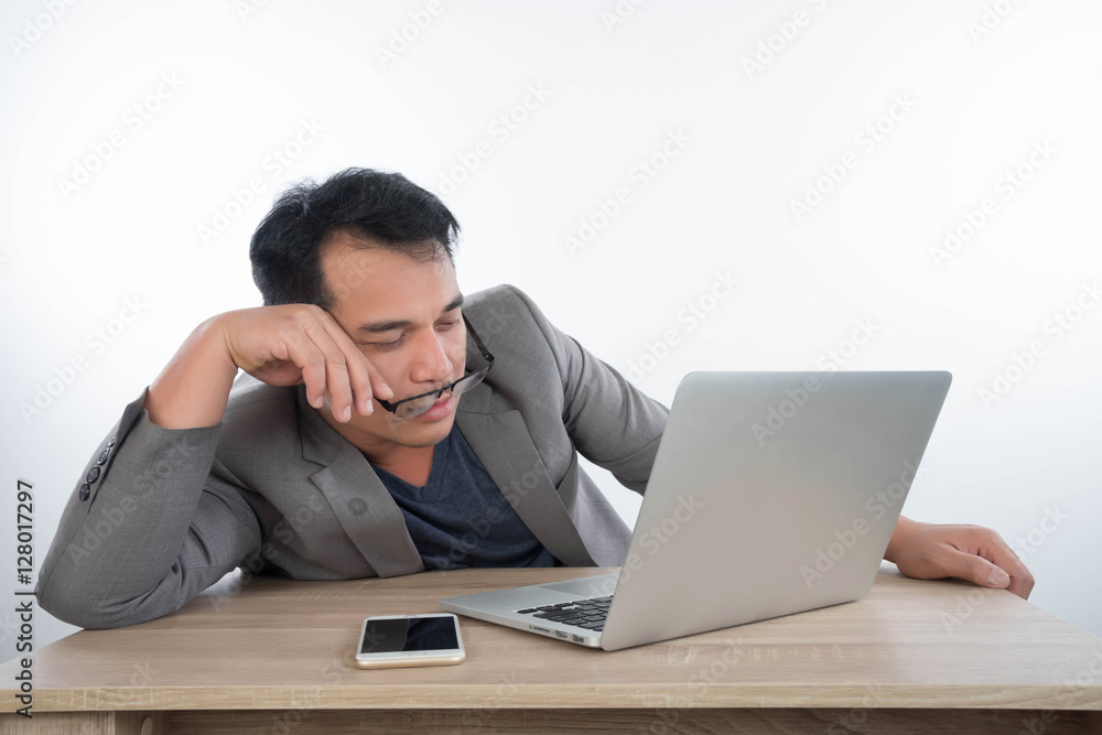 young businessman Stressful jobs using a laptop sitting thinking young businessman Stressful jobs using a laptop sitting thinking