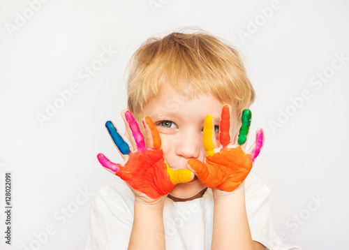 Close up portrait of cheerful funny small boy isolated on white background.