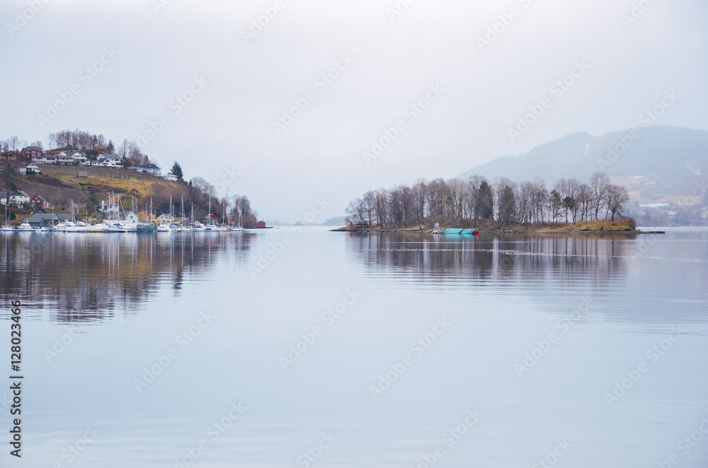 Two islands on norway lake with houses trees and boats. Original wallpaper from scandinavian landscape