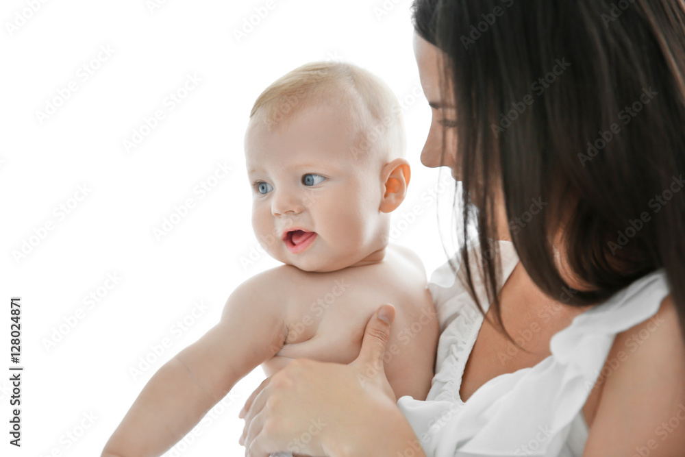 Mother holding little baby on light background Mother holding little baby on light background