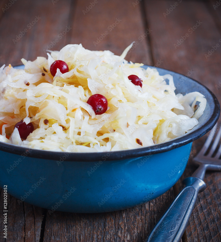Salad of sauerkraut and carrots in rustic style. Selective focus. Salad of sauerkraut and carrots in rustic style. Selective focus.